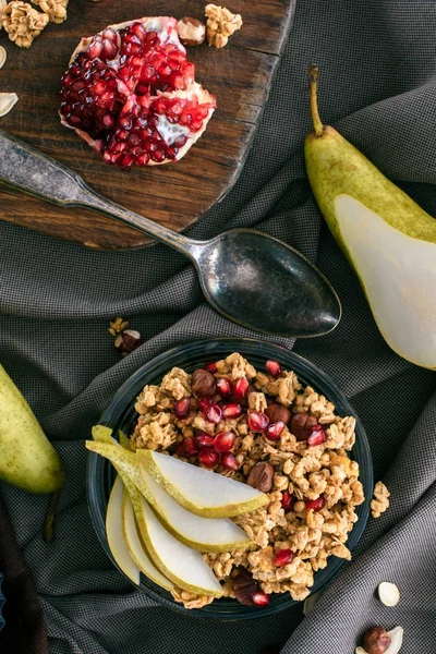 Top view of homemade granola with pomegranate seeds — Stock Photo