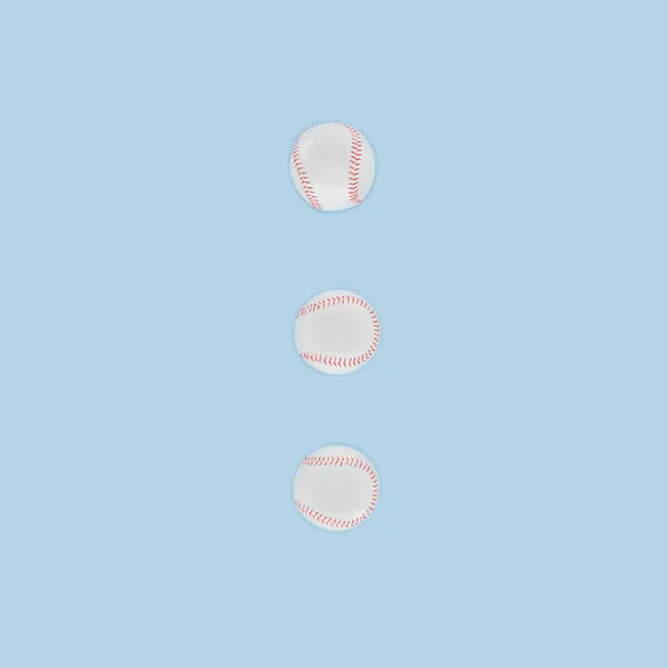 Baseball balls in a row isolated on blue — Stock Photo