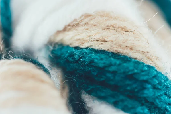 Close up view of blue, beige and white knitting wool ball — Stock Photo