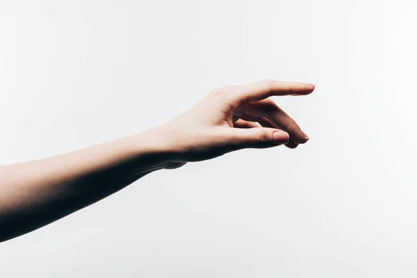 Cropped shot of woman pointing somewhere isolated on white — Stock Photo