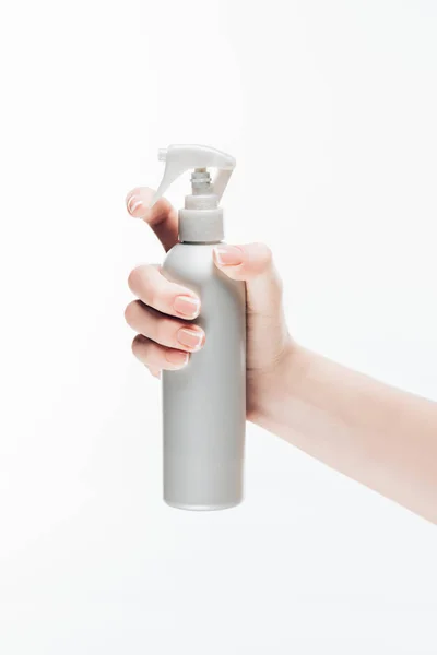 Cropped shot of woman holding blank cosmetic spray bottle isolated on white — Stock Photo