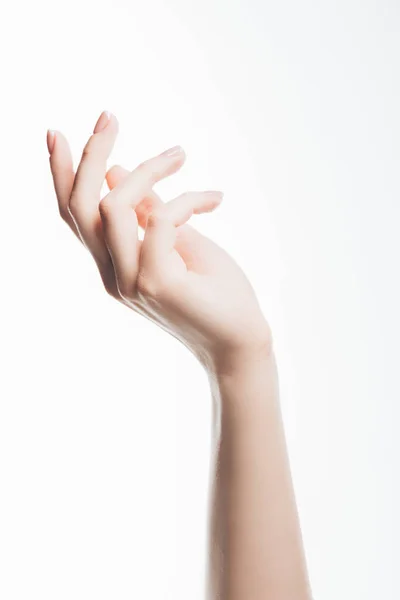 Cropped shot of female hand with beautiful clear skin isolated on white — Stock Photo