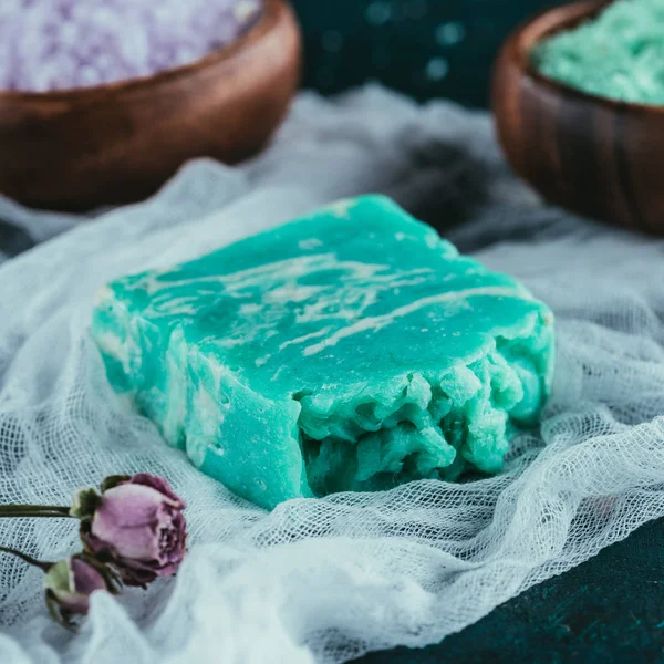 Close up of natural green soap for spa on gauze — Stock Photo