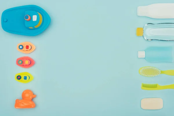 Top view of baby toys and bathroom accessories isolated on blue — Stock Photo