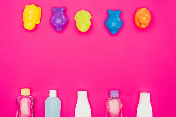 Top view of baby toys and bathroom accessories isolated on pink — Stock Photo