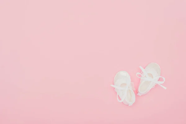 Top view of baby shoes isolated on pink — Stock Photo