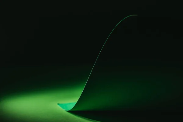 Green warping paper for decoration on black — Stock Photo