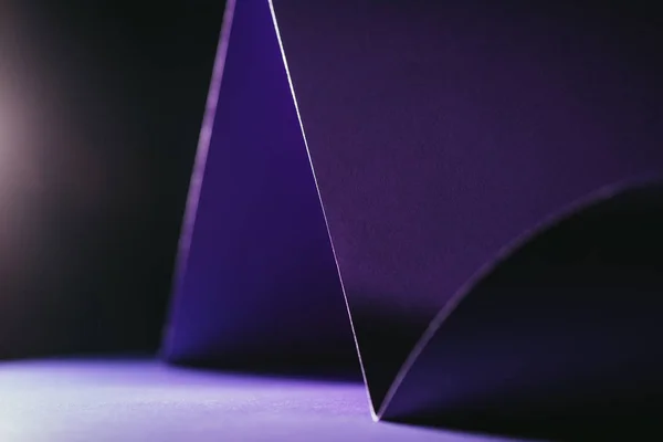 Close up view of purple paper on black — Stock Photo