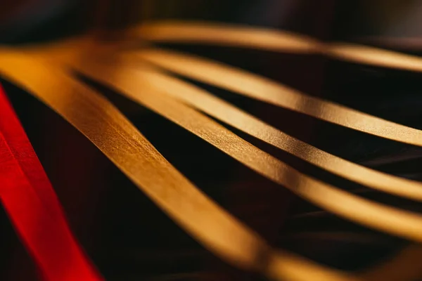 Close up view of yellow quilling striped paper on black — Stock Photo