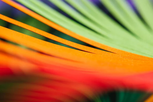 Close up view of green, yellow and red quilling striped paper — Stock Photo