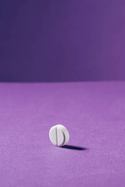 Close up view of medicine on purple background — Stock Photo