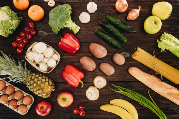 Set of vegetables and fruits on wooden table — Stock Photo