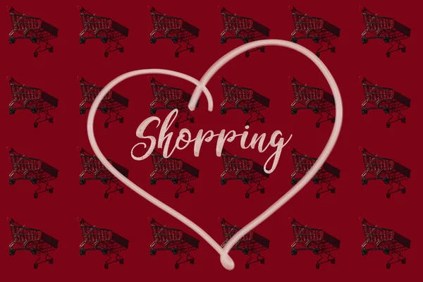 Conjunto de carrinhos de compras com sombras em vermelho com palavra de compras no coração — Fotografia de Stock