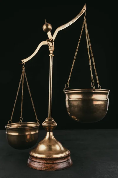 Vintage justice scales isolated on black — Stock Photo