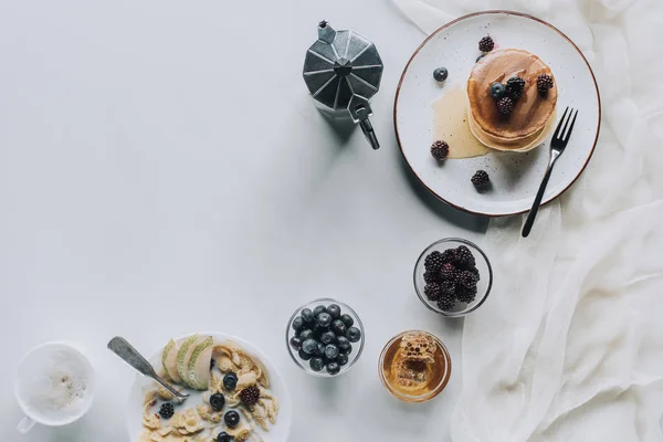 Top view of tasty healthy breakfast with pancakes and cappuccino on grey — Stock Photo