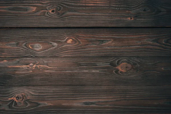 Vista superior de tablones de madera oscura, fondo de madera - foto de stock