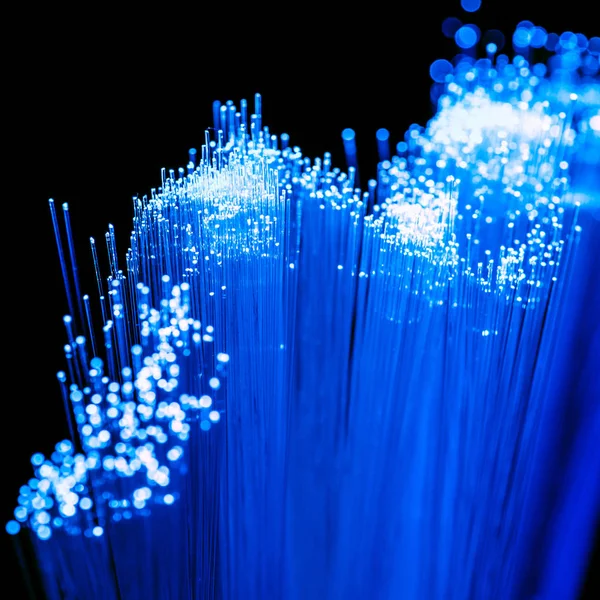 Close up of shiny blue fiber optics texture, communication technology — Stock Photo