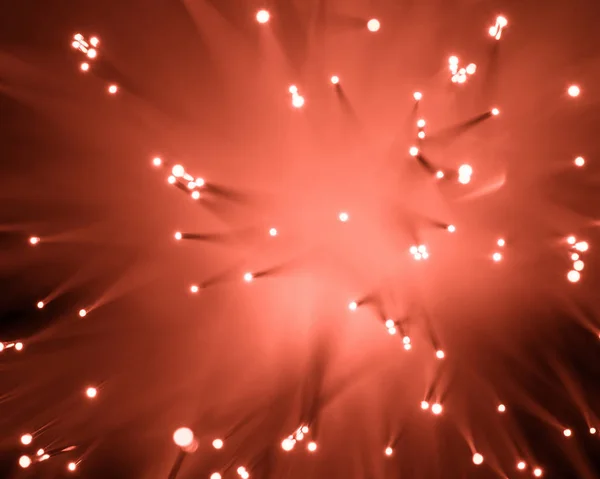 Top view of blurred glowing red fiber optics texture — Stock Photo