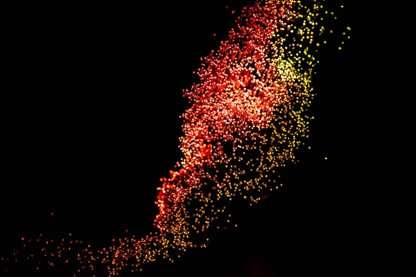 Resplandeciente fibra óptica roja sobre fondo oscuro, parece fuegos artificiales - foto de stock