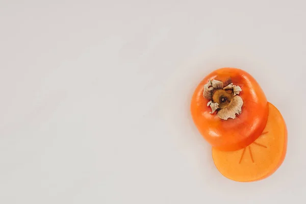 Top view of cut persimmon isolated on white — Stock Photo