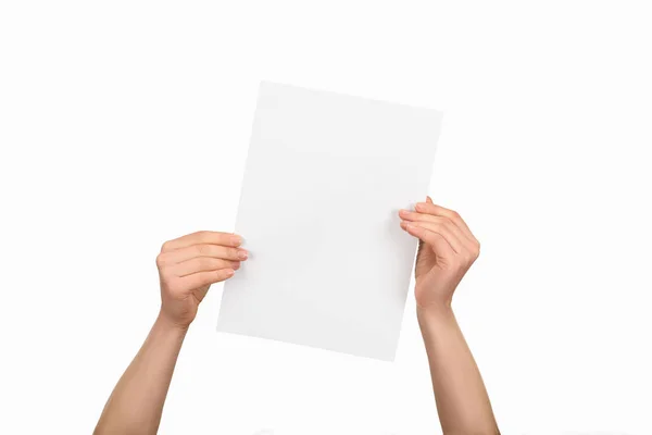 Cropped view of woman holding empty paper isolated on white — Stock Photo