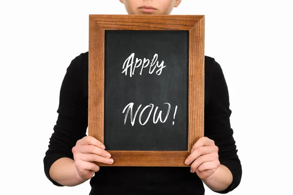 Partial view of woman holding board with lettering apply now isolated on white — Stock Photo