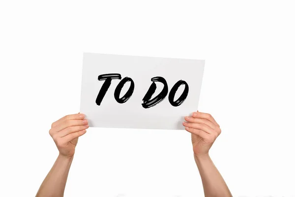 Cropped image of woman hands holding paper with lettering to do — Stock Photo