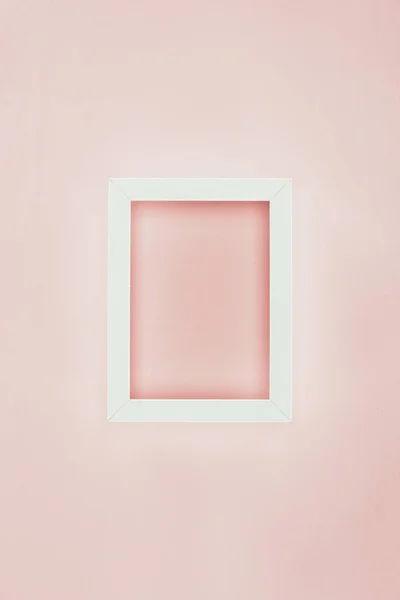 White empty wooden frame on pink background — Stock Photo