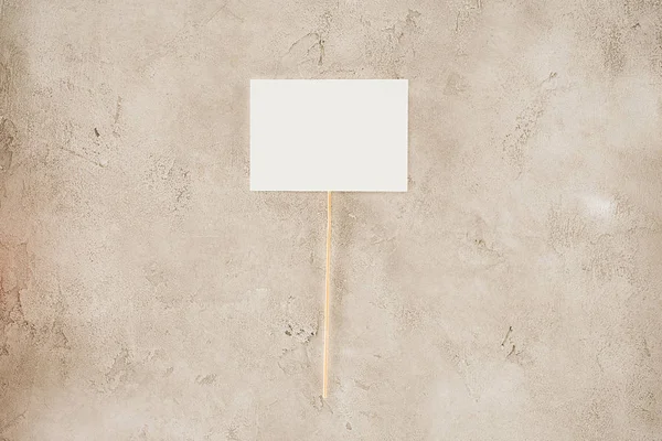 Top view of blank placard on concrete surface — Stock Photo