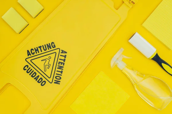 Top view of wet floor sign isolated on yellow — Stock Photo