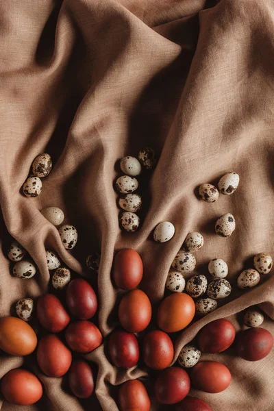 Food composition with easter chicken eggs and quail eggs on linen tablecloth — Stock Photo