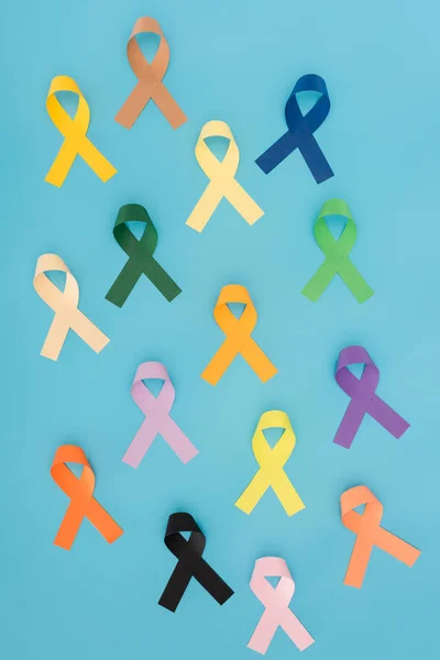 Flat lay with arranged colorful ribbons isolated on blue, world health day concept — Stock Photo