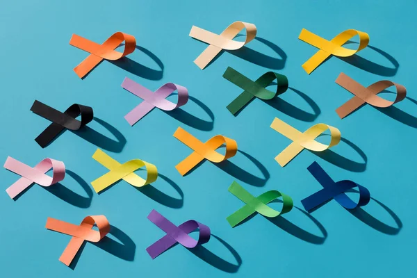 Flat lay with arranged colorful ribbons isolated on blue, world health day concept — Stock Photo