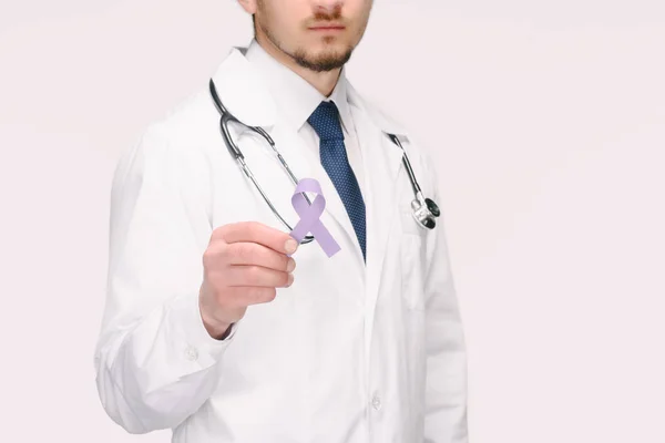 Cropped shot of doctor with stethoscope showing purple awareness ribbon for general cancer awareness, Lupus awareness, drug overdose, domestic violence symbol isolated on white — Stock Photo