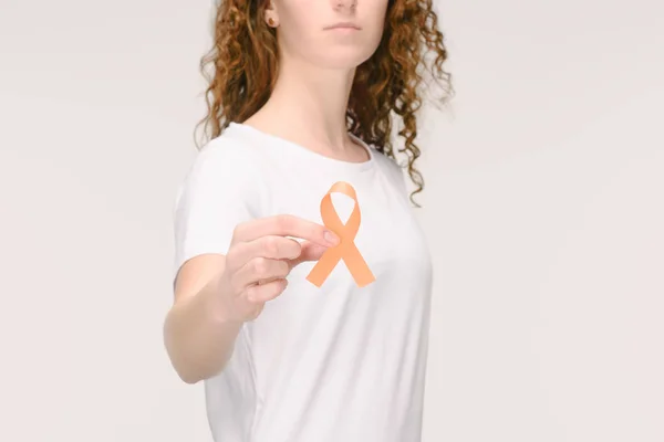 Cropped shot of woman showing leukemia, kidney cancer, multiple sclerosis RSD awareness ribbon in hand isolated on white — Stock Photo