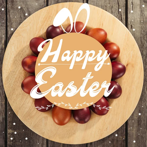 Top view of traditional painted easter eggs with happy easter inscription on table — Stock Photo