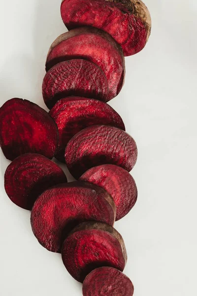 Top view of red sliced beetroot on grey — Stock Photo