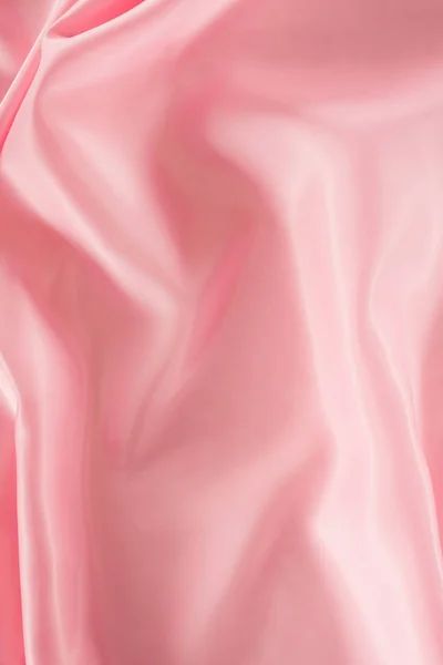 Pink shiny satin fabric background — Stock Photo