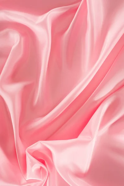 Pink shiny satin fabric background — Stock Photo