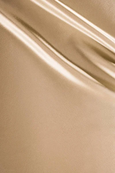 Fond de tissu satiné brillant doré — Photo de stock