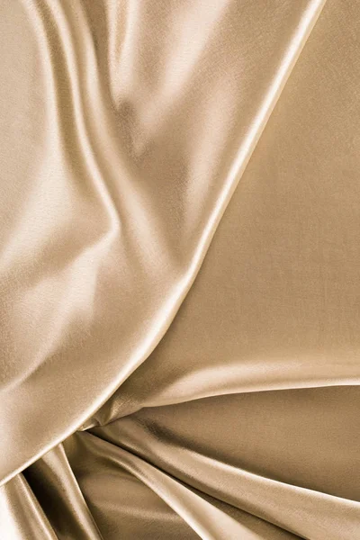 Golden crumpled satin fabric background — Stock Photo