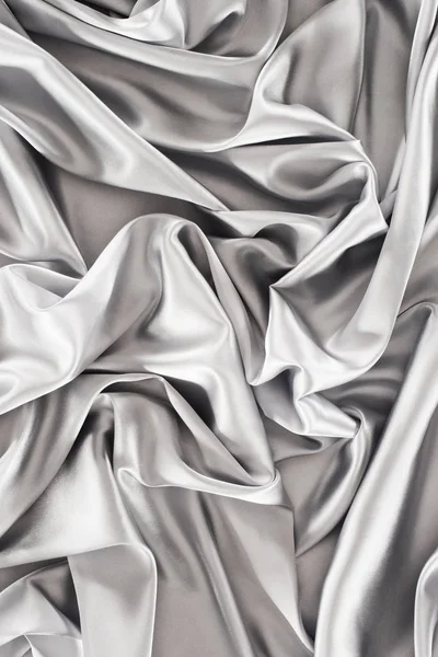 Silver elegant shiny silk fabric background — Stock Photo