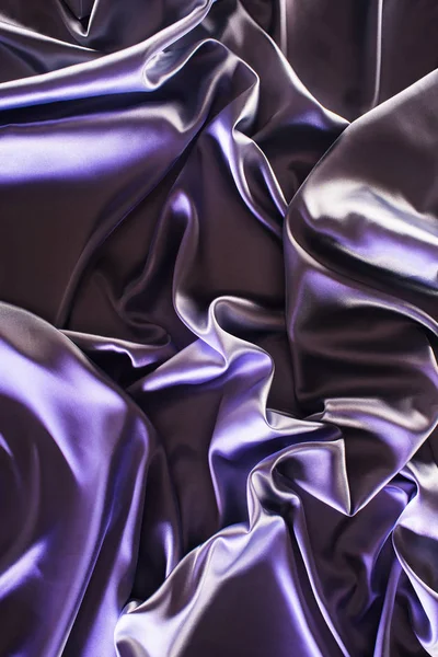 Ultra violet crumpled shiny silk fabric background — Stock Photo