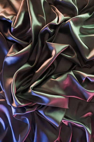 Colored crumpled soft satin fabric background — Stock Photo