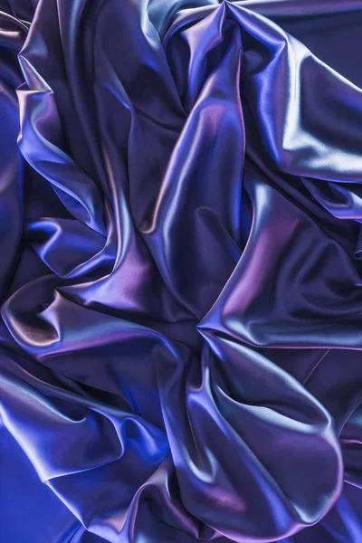 Ultra violet trendy shiny silk fabric background — Stock Photo