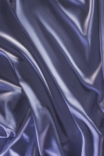 Violeta escuro tecido de seda macia fundo — Fotografia de Stock