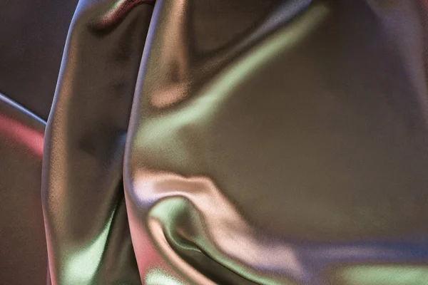 Fundo de tecido de seda brilhante verde e violeta — Fotografia de Stock