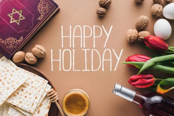 Top view of traditional book with text in hebrew and happy holiday greeting — Stock Photo