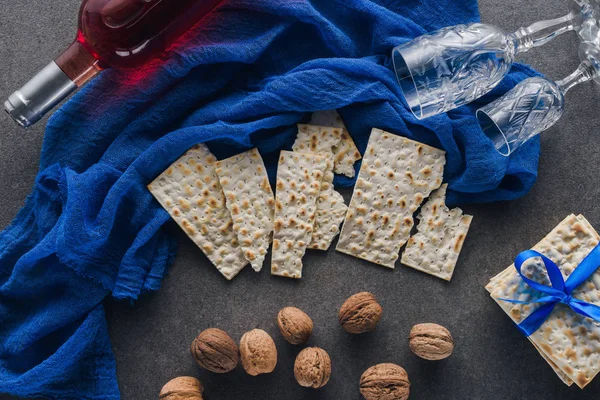 Top view of matza, wine and walnuts on table, jewish Passover holiday concept — Stock Photo