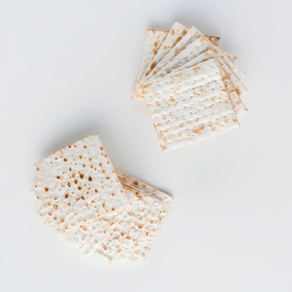Top view of matza on white table, jewish Passover holiday concept — Stock Photo